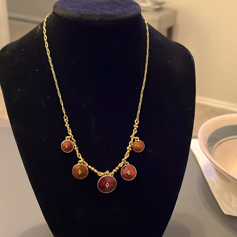 Gold tone shaky charm necklace